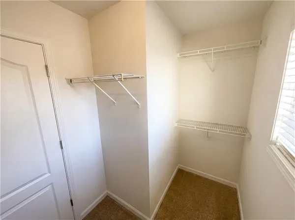 a spacious bathroom with a double vanity sink mirror and toilet