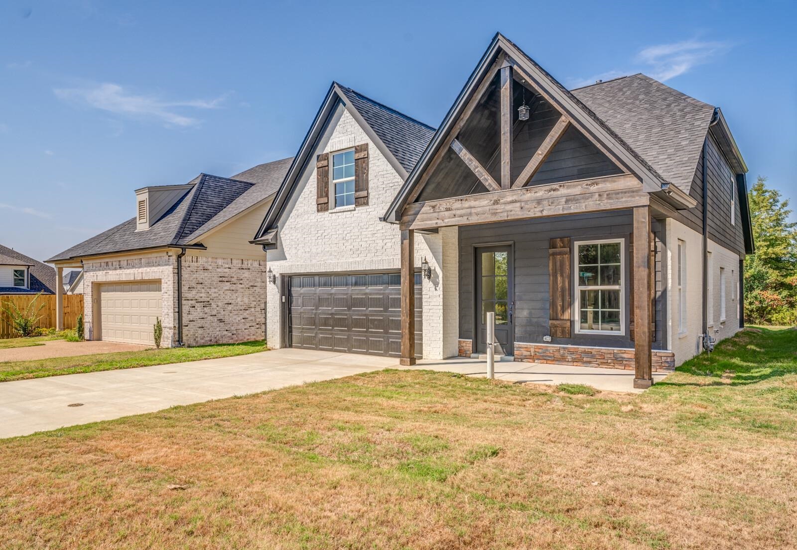 60 Umble Street Oakland, TN 38060 - Photo 3 of 40 a front view of a house with a yard