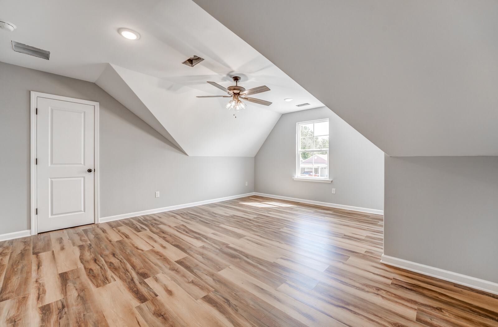 60 Umble Street Oakland, TN 38060 - Photo 31 of 40 a view of an empty room and window with wooden floor