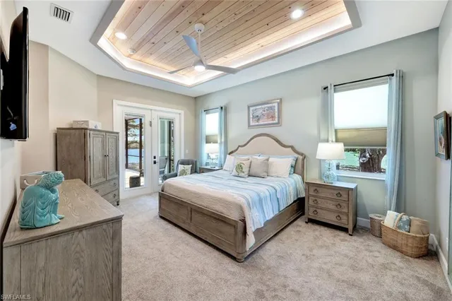 a bedroom with a bed a couch and dresser