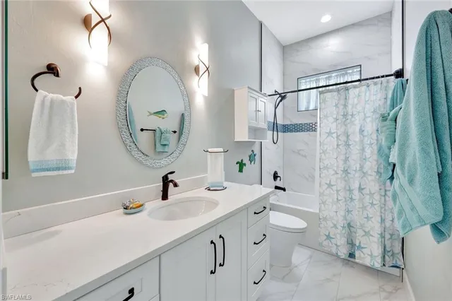 a bathroom with a double vanity sink mirror and shower