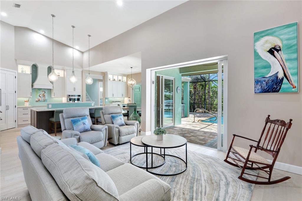 144 Wilderness Cay Naples, FL 34114 - Photo 3 of 42 a living room with furniture and a large window