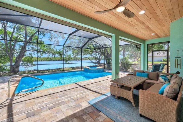 a roof deck with couch and chairs