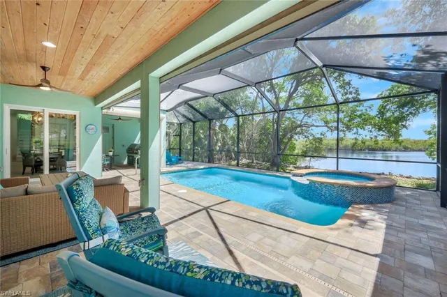 a view of swimming pool with outdoor seating