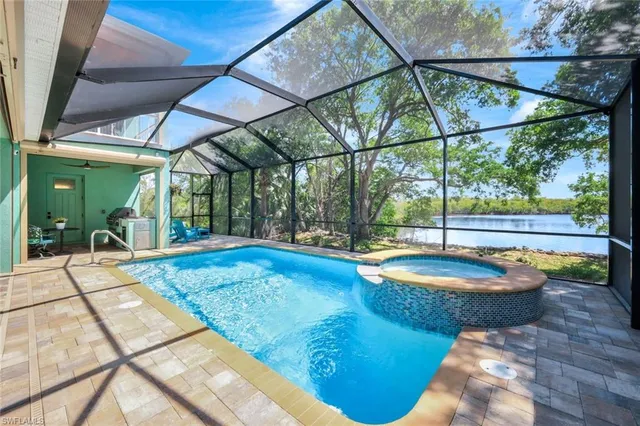 a view of swimming pool with a patio