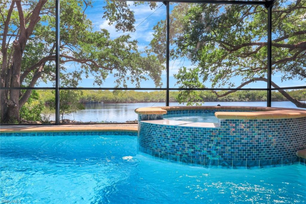 144 Wilderness Cay Naples, FL 34114 - Photo 36 of 42 a view of swimming pool with an outdoor space