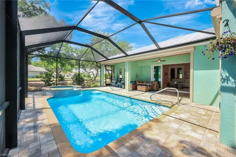 a view of swimming pool with patio