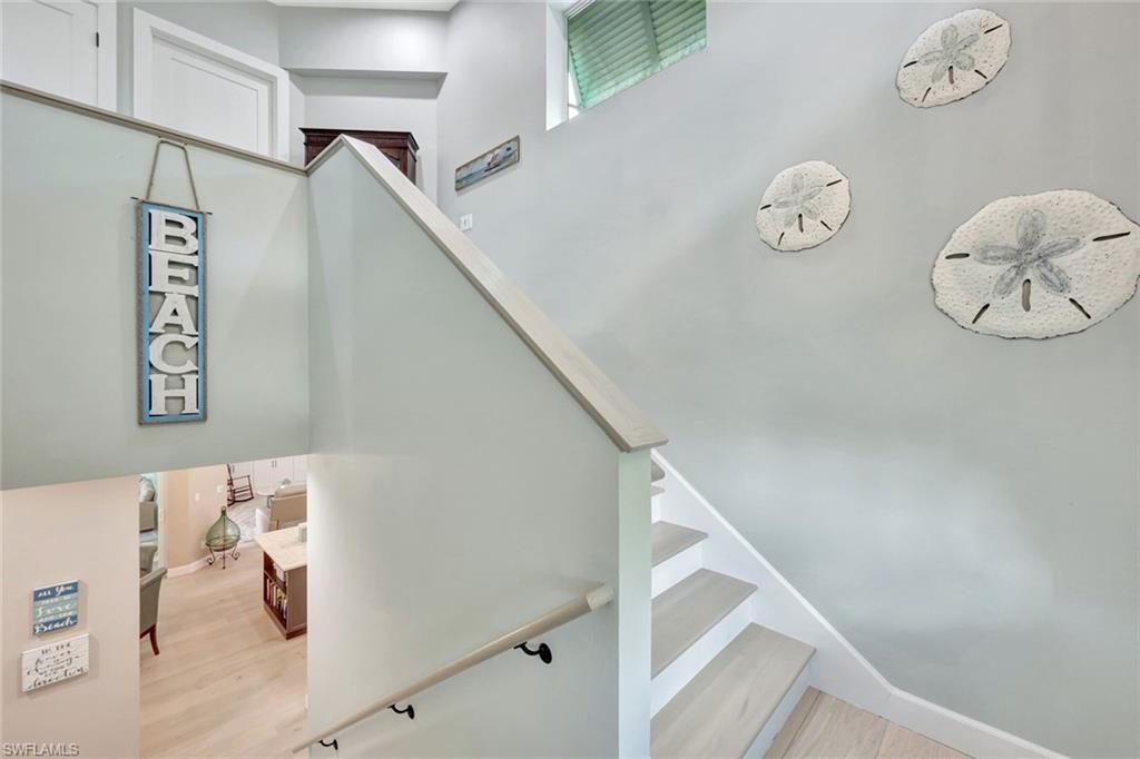 144 Wilderness Cay Naples, FL 34114 - Photo 4 of 42 a view of entryway with stairs and wooden floor