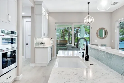 a very nice looking dining room with a large window