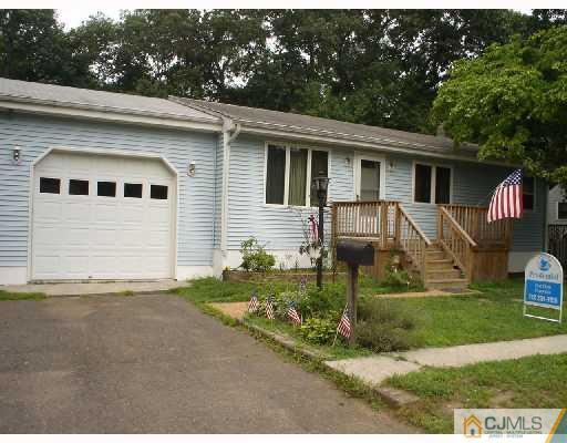 25 Red Bank Road Spotswood, NJ 08884 - Photo 2 of 2 a front view of a house with a yard