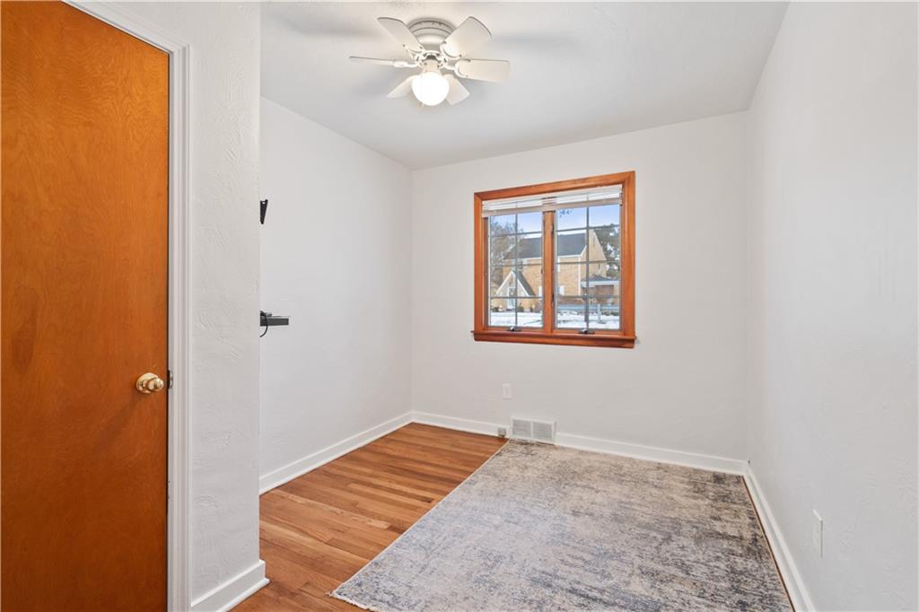 903 Wible Run Road Pittsburgh, PA 15209 - Photo 13 of 33 a bedroom with a bed and a window