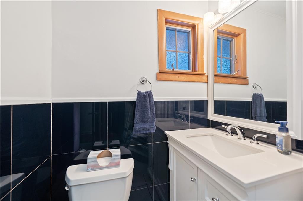 903 Wible Run Road Pittsburgh, PA 15209 - Photo 20 of 33 a bathroom with a sink vanity and toilet