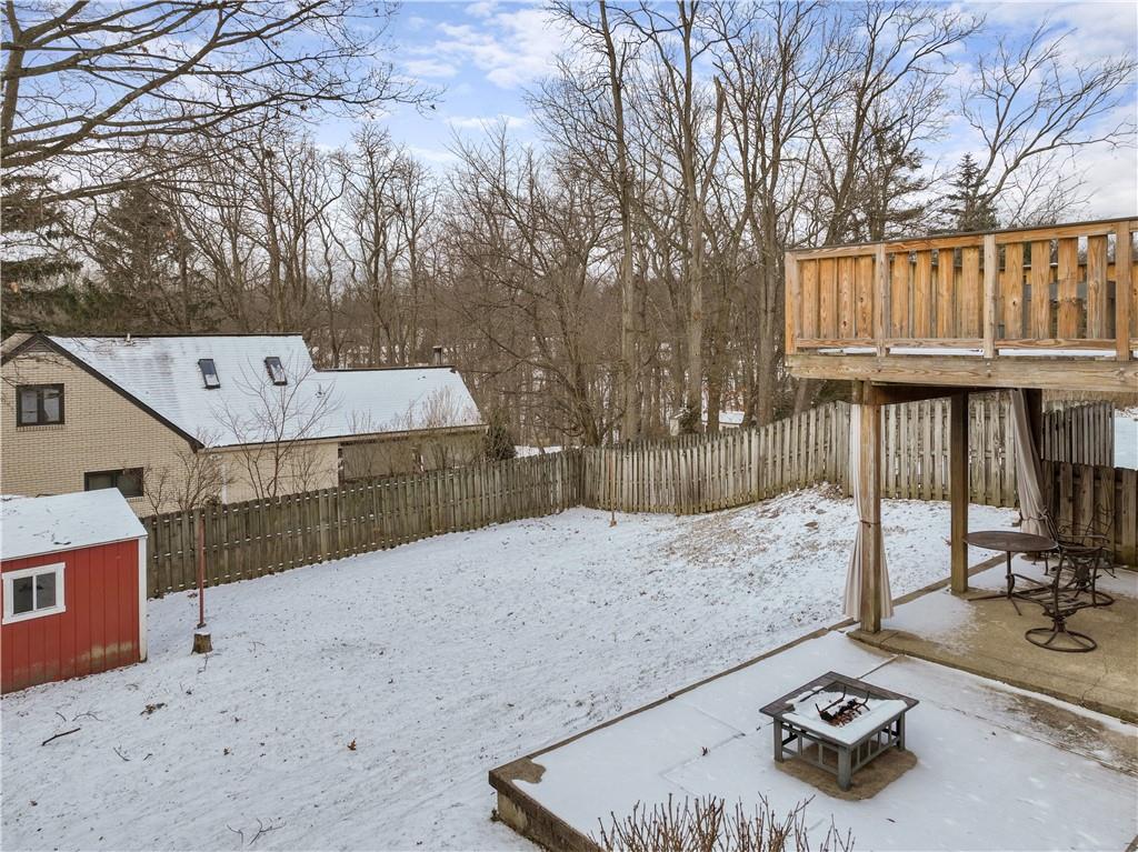903 Wible Run Road Pittsburgh, PA 15209 - Photo 30 of 33 a backyard of a house with barbeque oven and outdoor seating