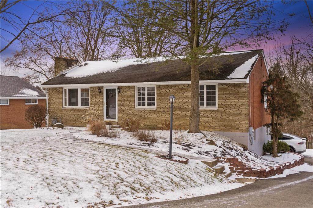 903 Wible Run Road Pittsburgh, PA 15209 - Photo 33 of 33 a front view of a house with a yard covered in snow