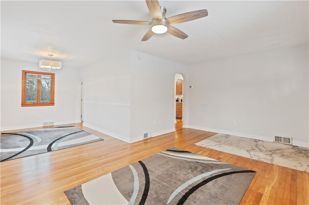 903 Wible Run Road Pittsburgh, PA 15209 - Photo 6 of 33 a bedroom with a bed and a chandelier