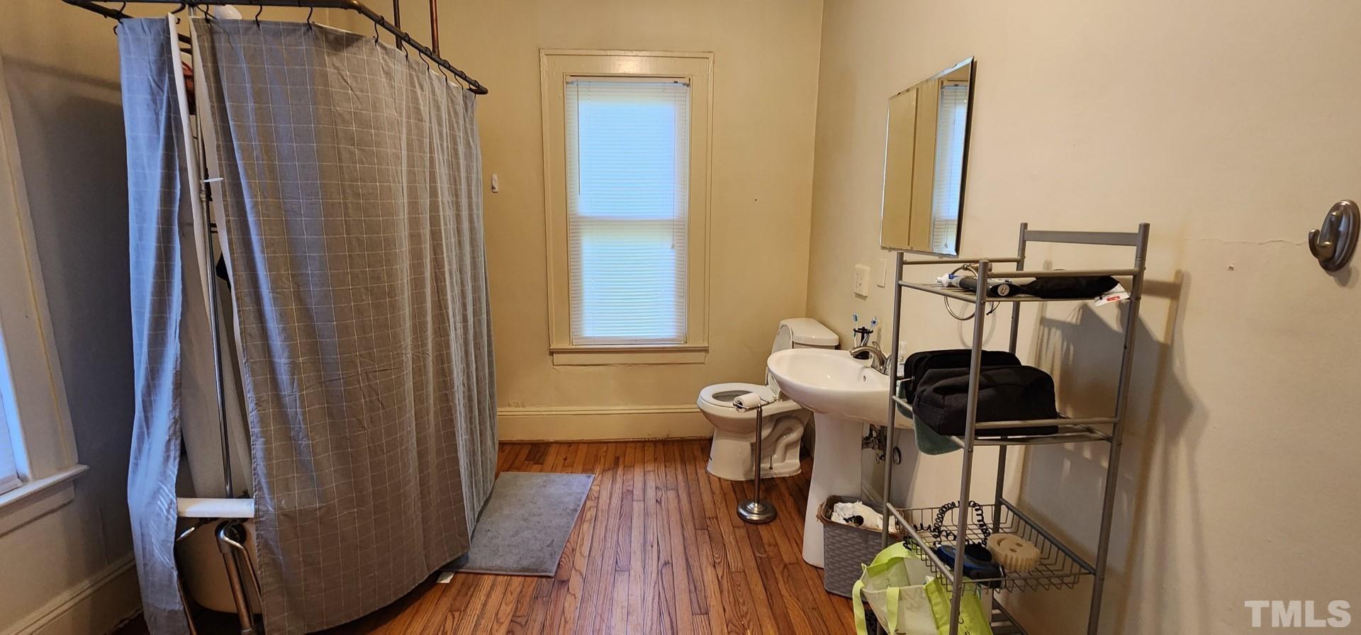 9 Dixie Trail Raleigh, NC 27607 - Photo 11 of 14 a view of a room with furniture and wooden floor