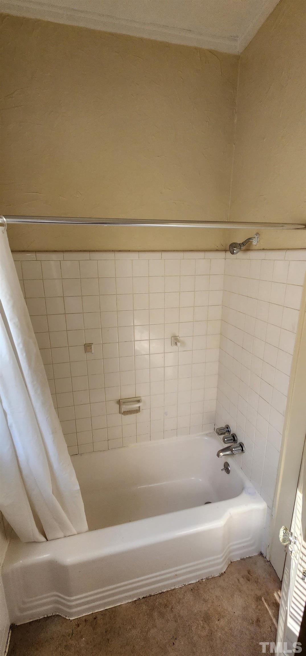 9 Dixie Trail Raleigh, NC 27607 - Photo 13 of 14 a bathroom with a bathtub and shower