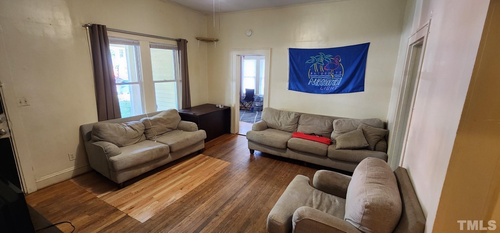 9 Dixie Trail Raleigh, NC 27607 - Photo 3 of 14 a living room with furniture and a window