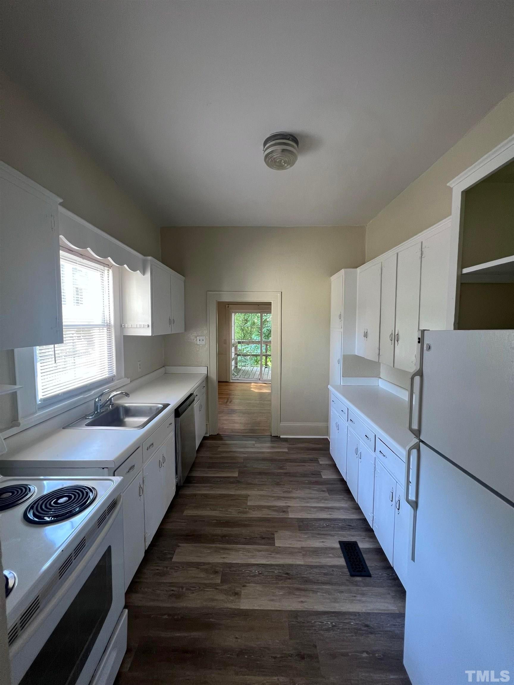 9 Dixie Trail Raleigh, NC 27607 - Photo 5 of 14 a kitchen with sink window and cabinets