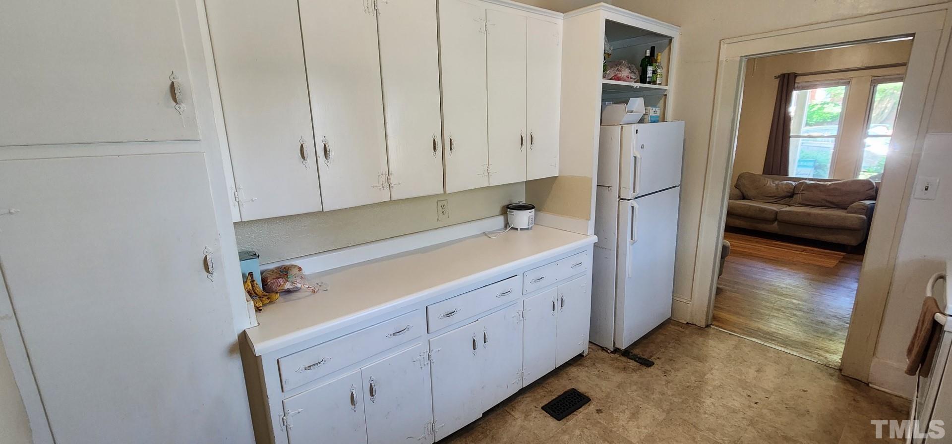 9 Dixie Trail Raleigh, NC 27607 - Photo 6 of 14 a hallway with cabinets