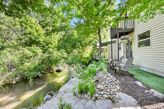 655 Ogden Canyon Road Ogden, UT 84401 - Photo 28 of 50 Waterside property featuring a multi-level deck, a private ground-level patio, and stone steps descending to the water's edge