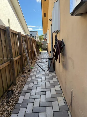 a view of a backyard with sitting area
