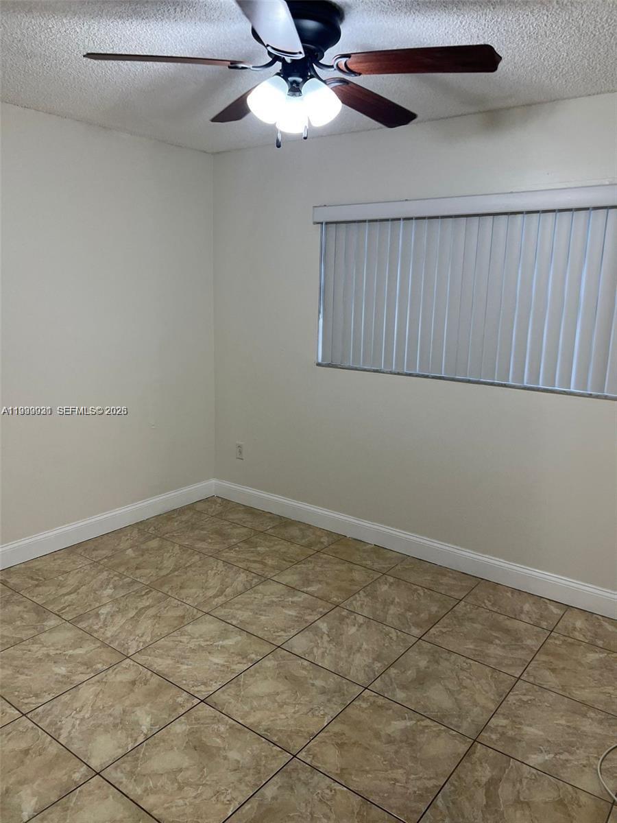 18210 Mediterranean Boulevard, Unit 620 Hialeah, FL 33015 - Photo 11 of 27 a view of an empty room