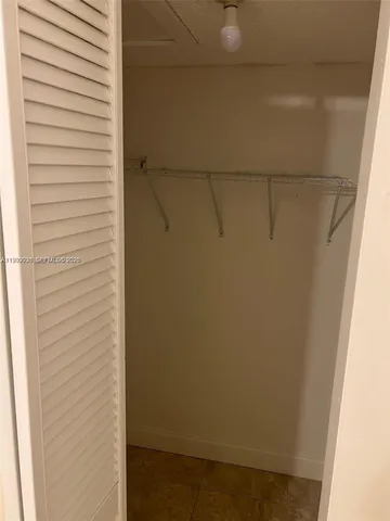 a view of a closet in an empty room