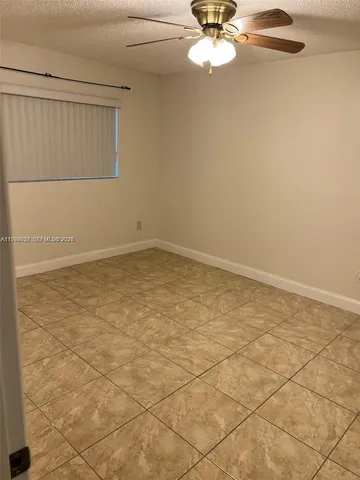 an empty room with a bathroom