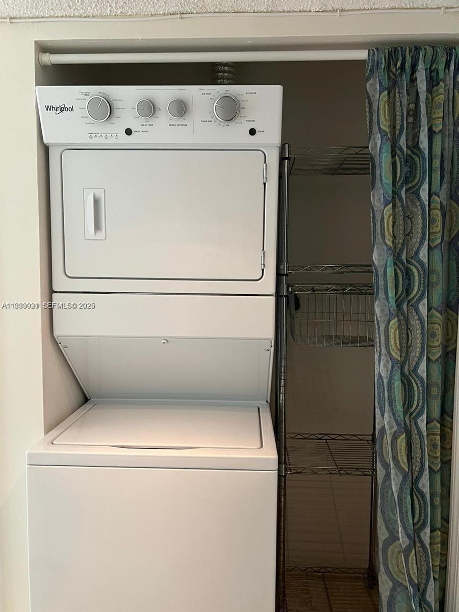 18210 Mediterranean Boulevard, Unit 620 Hialeah, FL 33015 - Photo 19 of 27 a close up view of washer and dryer with washer