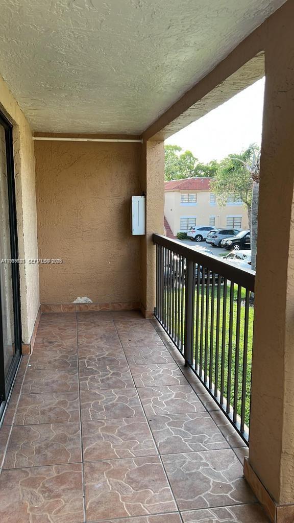 18210 Mediterranean Boulevard, Unit 620 Hialeah, FL 33015 - Photo 24 of 27 a view of a balcony