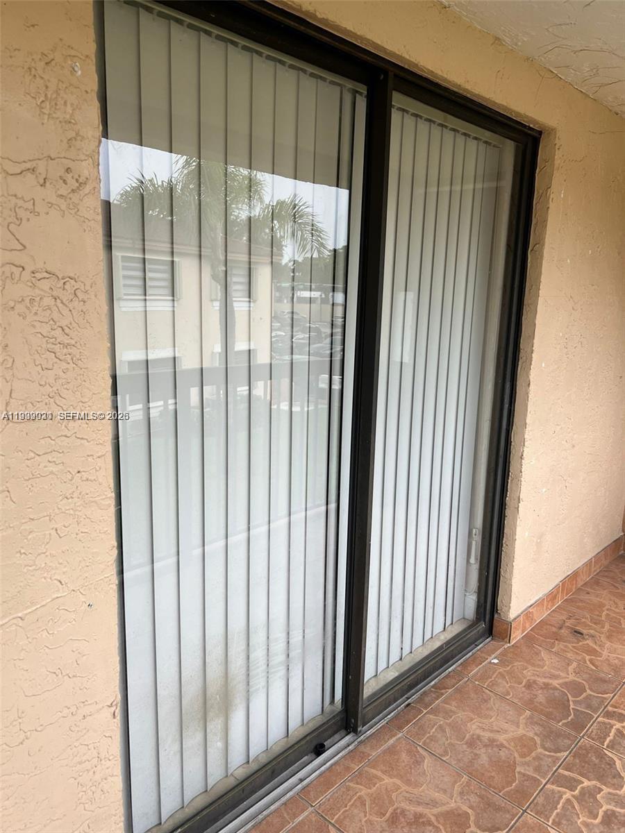 18210 Mediterranean Boulevard, Unit 620 Hialeah, FL 33015 - Photo 25 of 27 a view of a window in an empty room