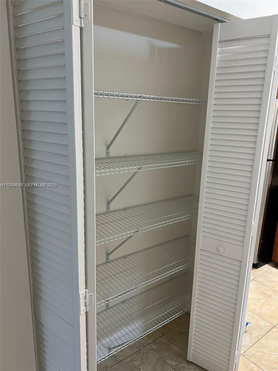 18210 Mediterranean Boulevard, Unit 620 Hialeah, FL 33015 - Photo 9 of 27 a view of walk in closet