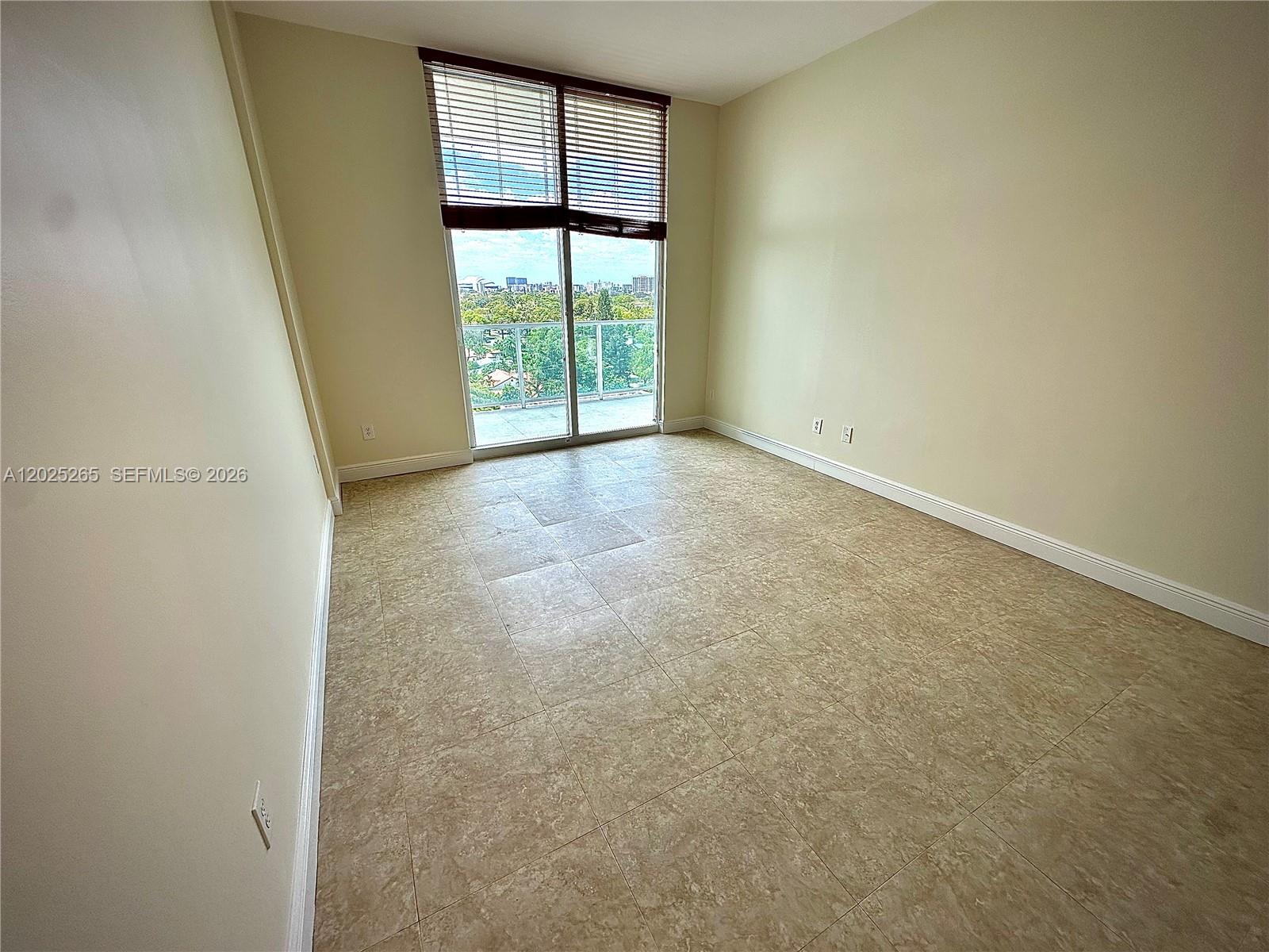 2525 Southwest 3rd Avenue, Unit 705 Miami, FL 33129 - Photo 6 of 26 an empty room with windows