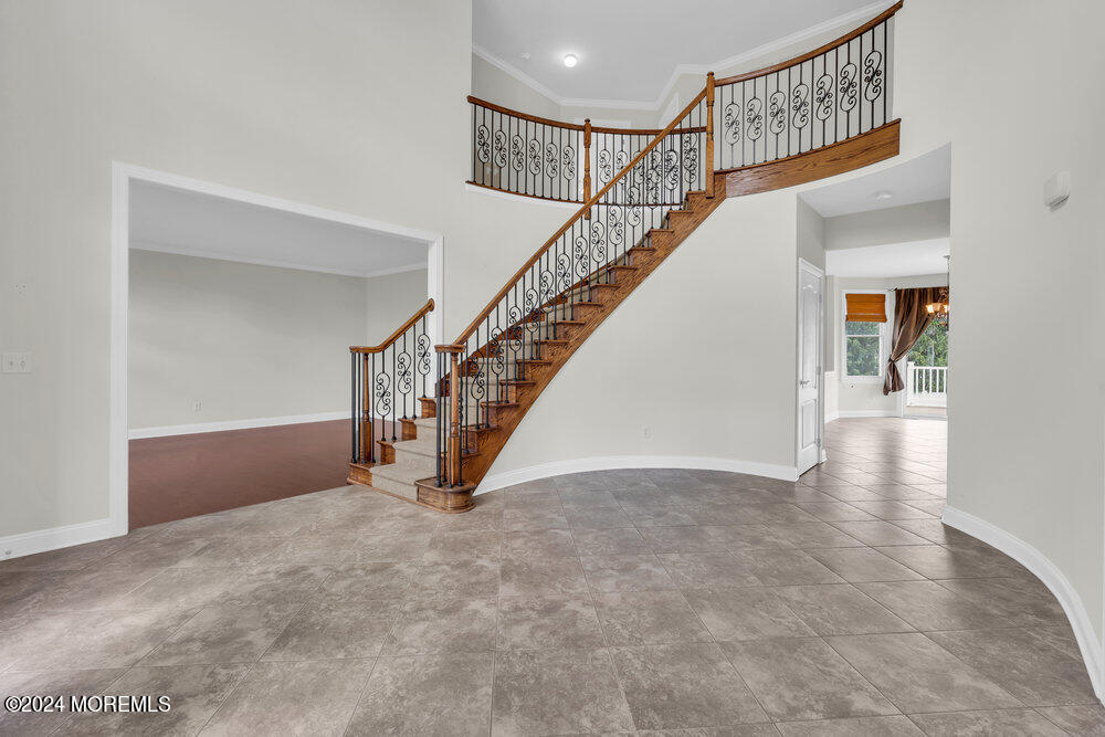 10 Hanging Rock Road Freehold, NJ 07728 - Photo 8 of 61 a view of an empty room with stairs