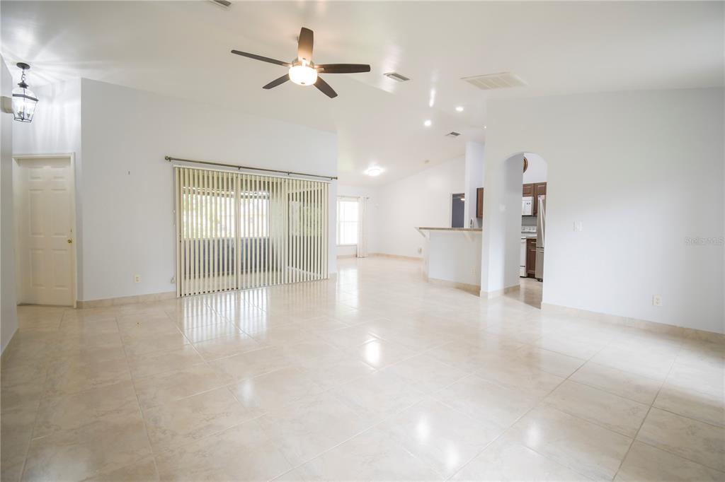 4913 Cromey Road North Port, FL 34288 - Photo 5 of 36 a view of an empty room with a window