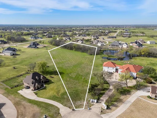 an aerial view of a house with outdoor space