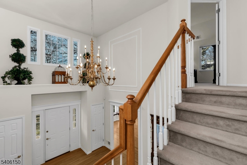 842 Madison Avenue Bridgewater, NJ 08807 - Photo 20 of 50 a view of entryway with wooden floor and a chandelier