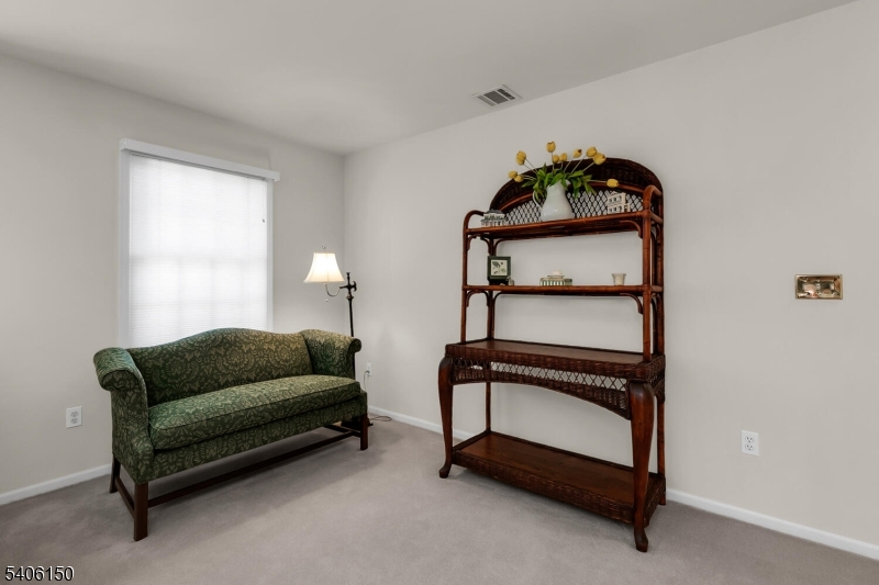 842 Madison Avenue Bridgewater, NJ 08807 - Photo 23 of 50 a living room with furniture and a window