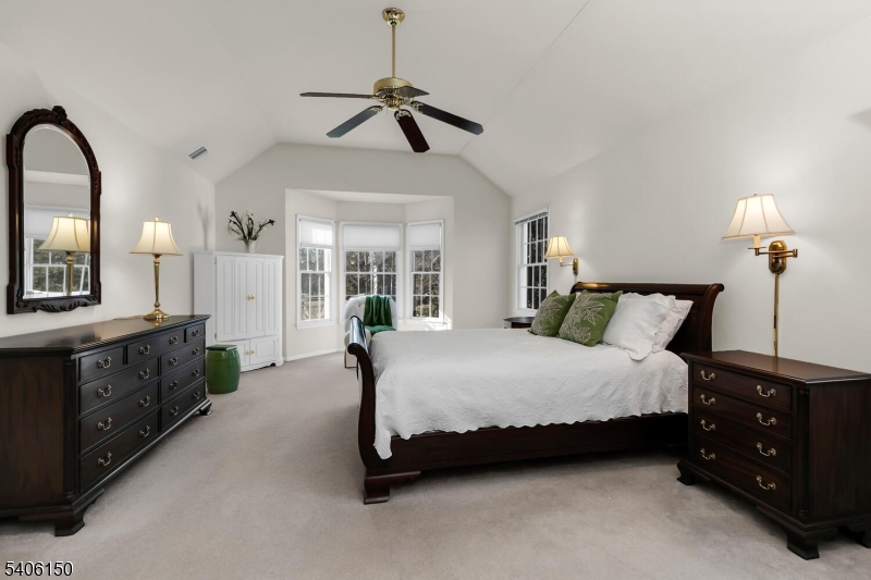 842 Madison Avenue Bridgewater, NJ 08807 - Photo 25 of 50 a spacious bedroom with a bed a dresser and potted plants