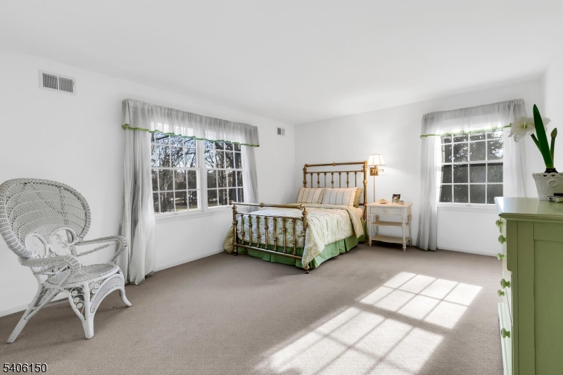 842 Madison Avenue Bridgewater, NJ 08807 - Photo 32 of 50 a bedroom with a bed chair and window