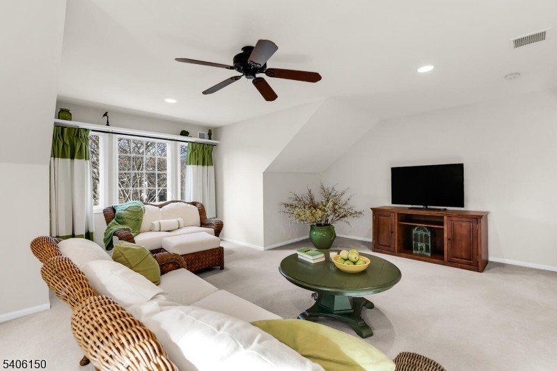 842 Madison Avenue Bridgewater, NJ 08807 - Photo 34 of 50 a living room with furniture and a flat screen tv