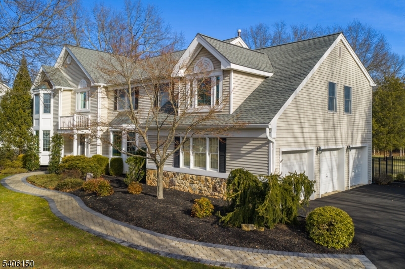 842 Madison Avenue Bridgewater, NJ 08807 - Photo 48 of 50 a view of a white house next to a yard with potted plants