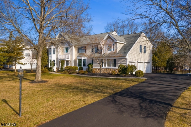 842 Madison Avenue Bridgewater, NJ 08807 - Photo 49 of 50 a front view of a house with a yard and large trees