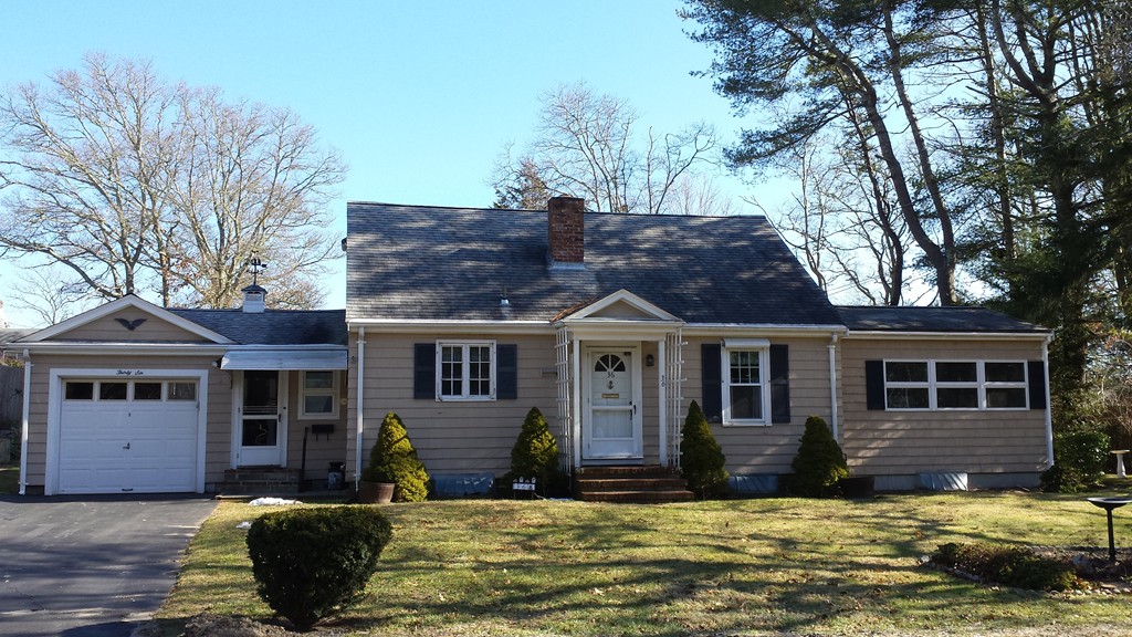 36 Puritan Road Bourne, MA 02532 - Photo 1 of 9 front view of a house with a yard
