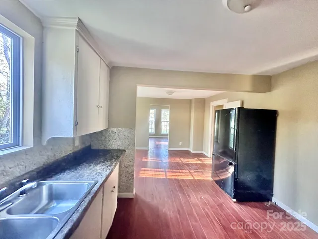a kitchen with a sink and refrigerator