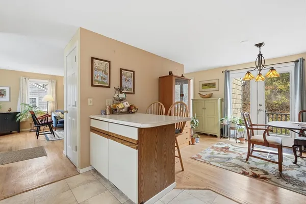 a living room with furniture a dining table and chairs