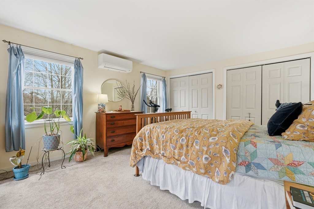 58 A Laurel Street, Unit 58A Greenfield, MA 01301 - Photo 19 of 35 a bedroom with a bed and a dresser