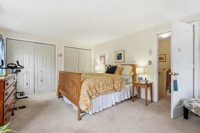 a spacious bedroom with a bed and a couch