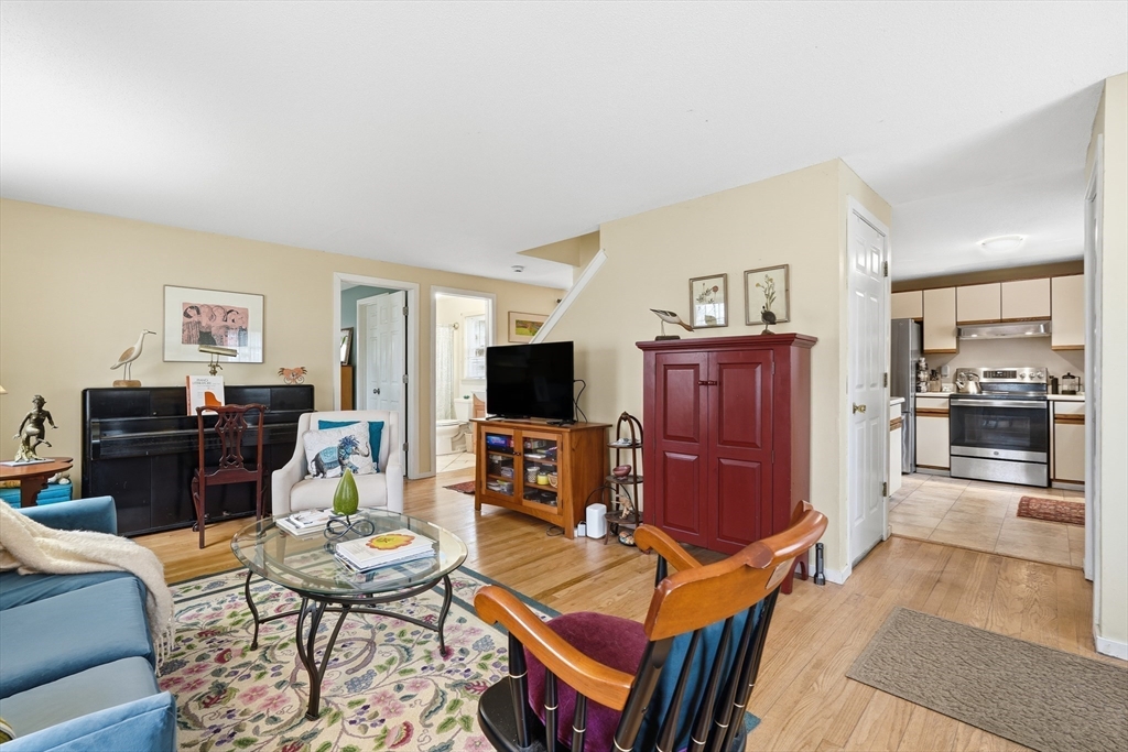 58 A Laurel Street, Unit 58A Greenfield, MA 01301 - Photo 6 of 35 a living room with furniture and a flat screen tv